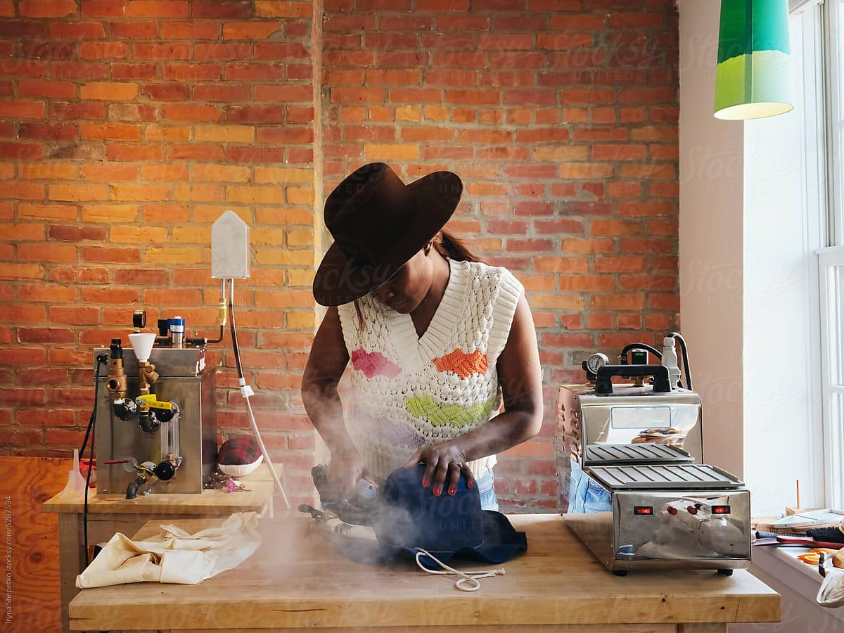 Black Woman Hat Maker In A Workshop Space. by Stocksy Contributor Iryna  Shepetko - Stocksy