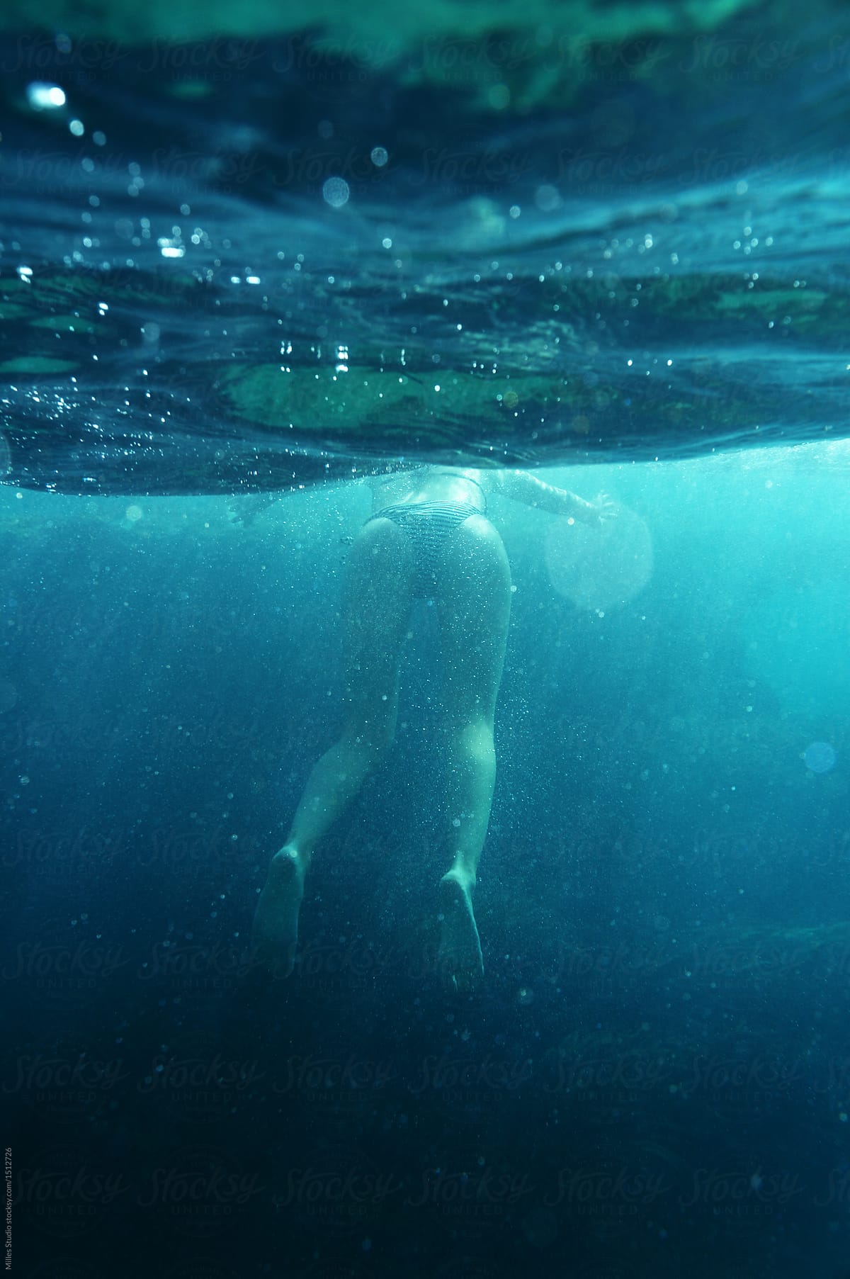 Attractive woman swimming in ocean