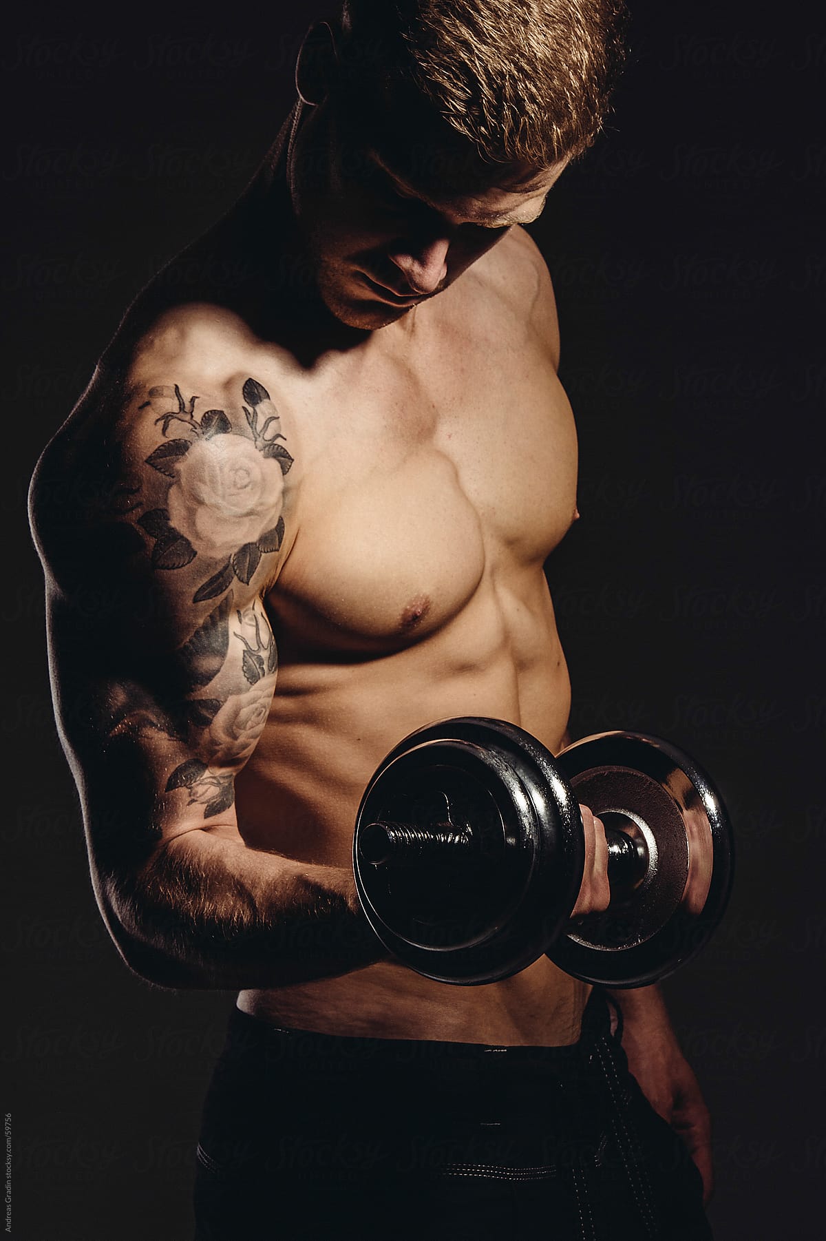male fitness man posing his muscles