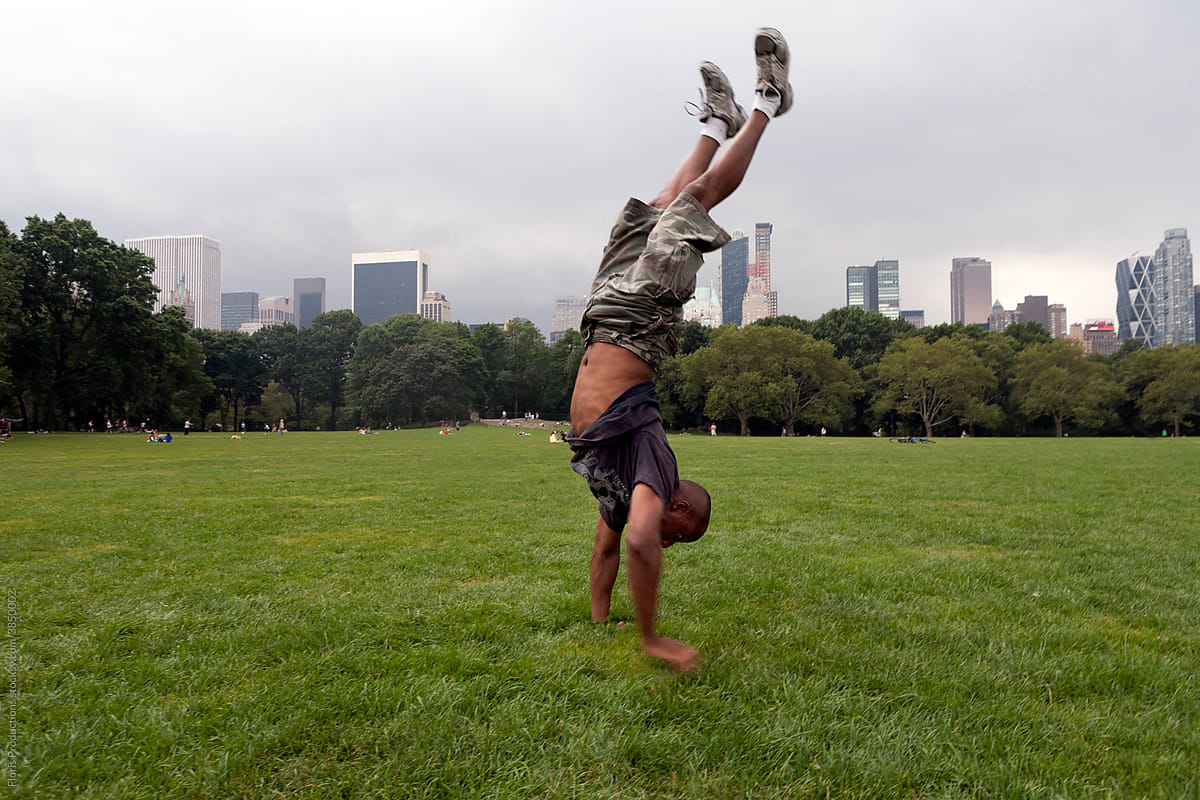 Man doing a handstand in Central park.