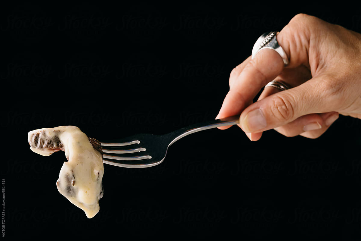 Crop faceless woman with fork and knife