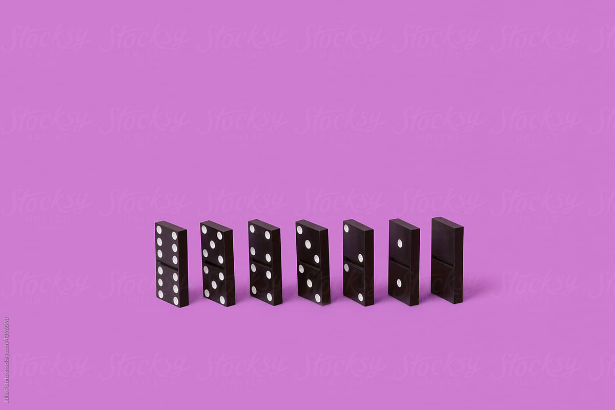 Dominoes from 6 to 0 on lilac background