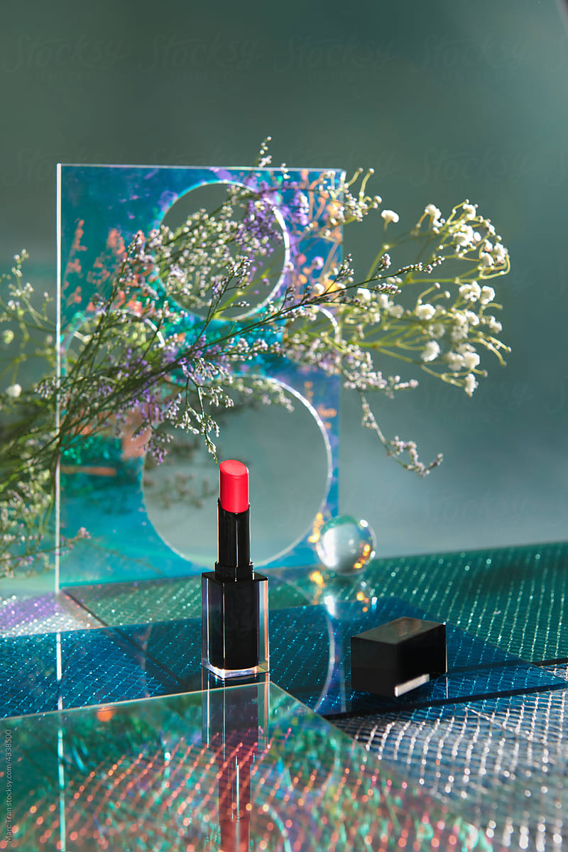 red lipstick on podium cosmetic display