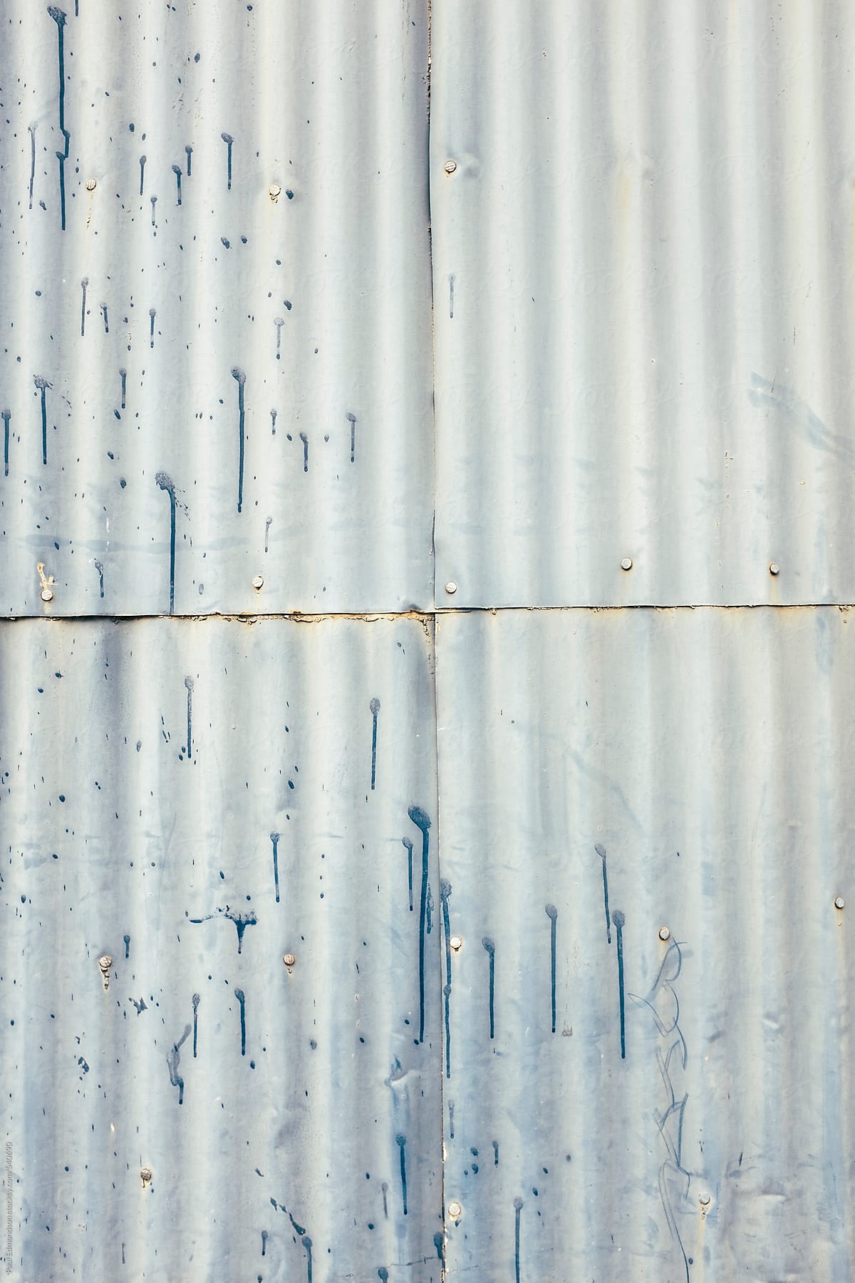 Detail of old metal, corrugated siding on warehouse exterior