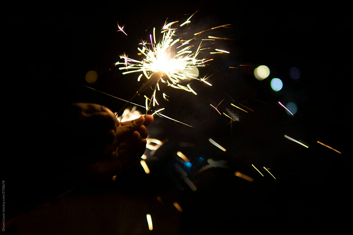 Sparklers burning at night in new year