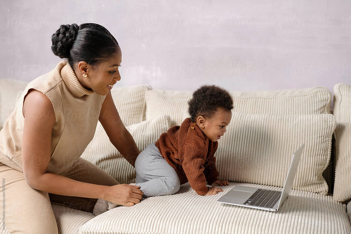 Mother and Child Enjoying Laptop Time at home
