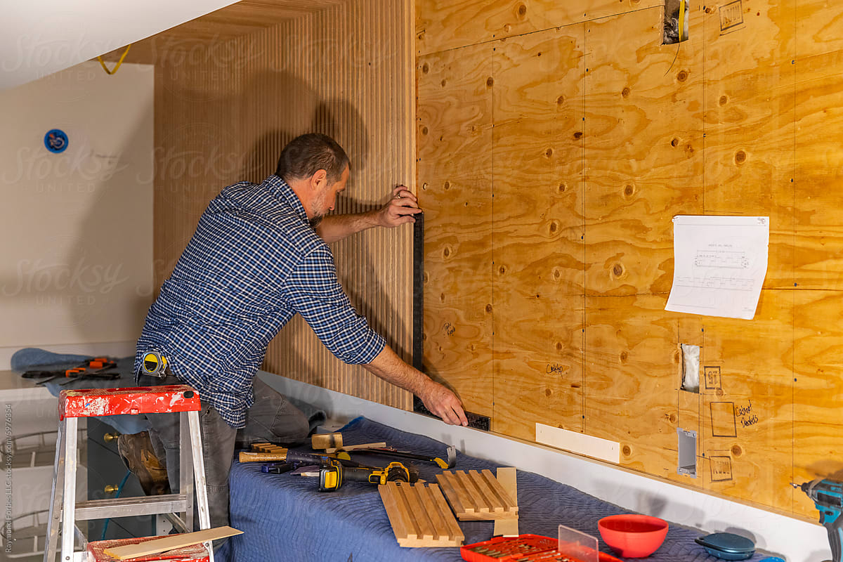 Home Construction Carpenter with tool building Vertical wall