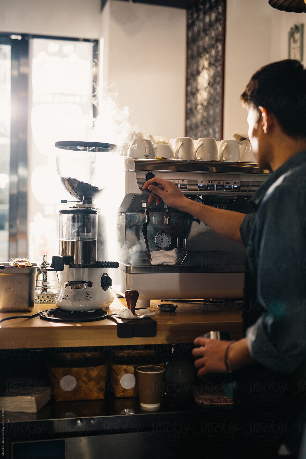 Young shop owner making coffee - Stock Image - Everypixel
