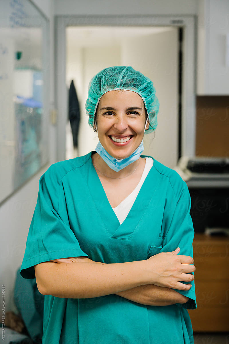 Cheerful female doctor in uniform