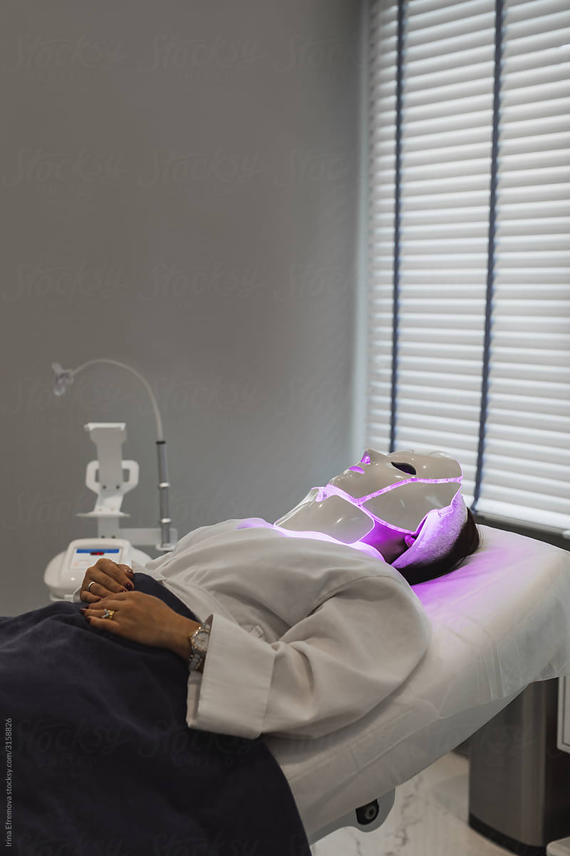 Woman receiving LED photon therapy treatment
