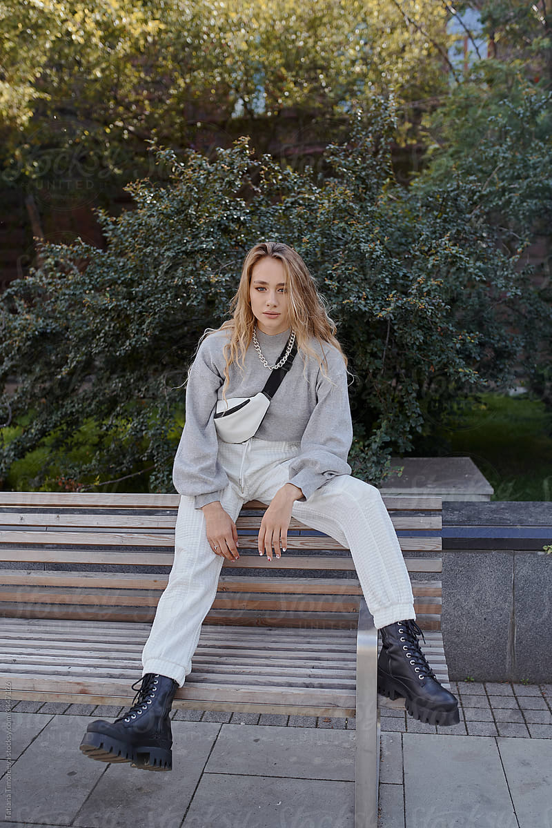 modern woman in white city look autumn mood