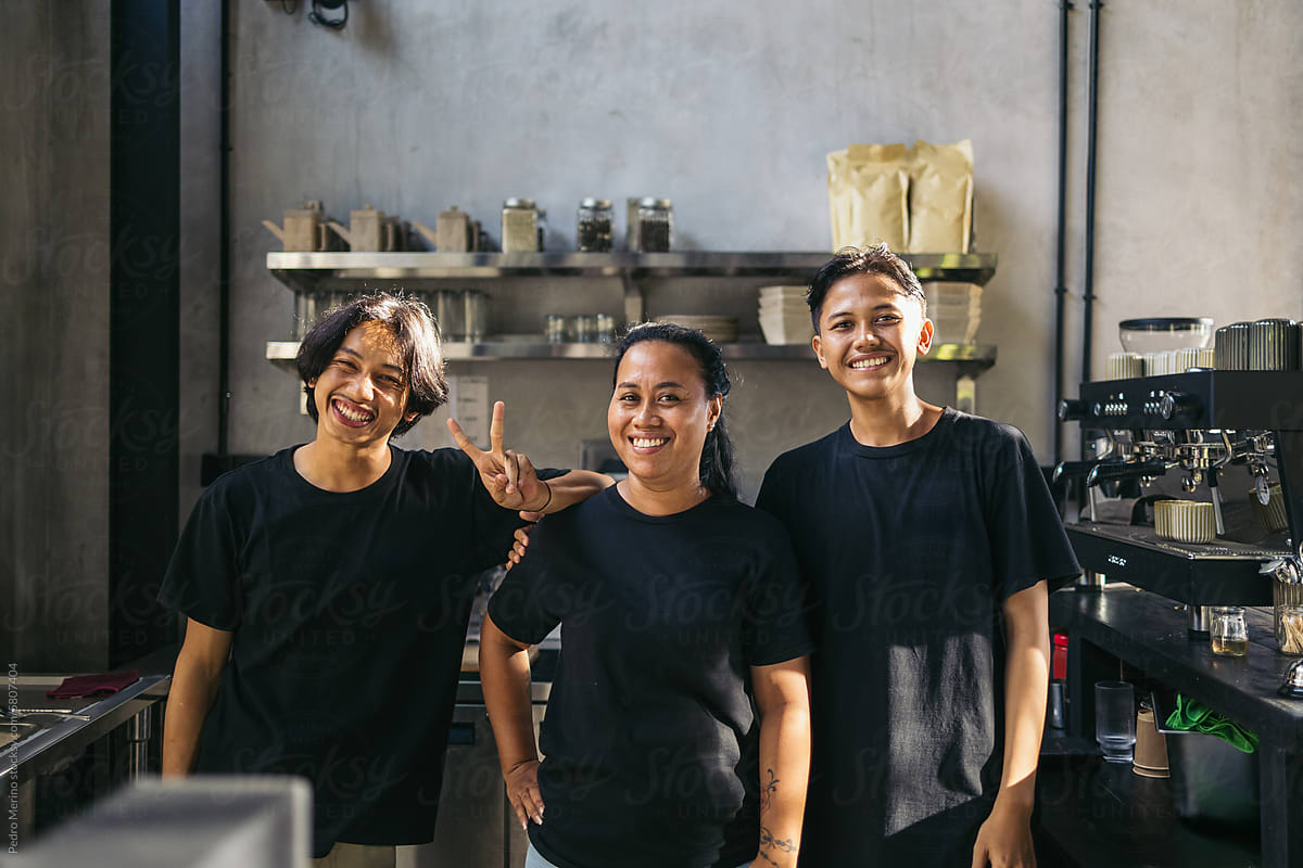 team of employees working in a modern cafe