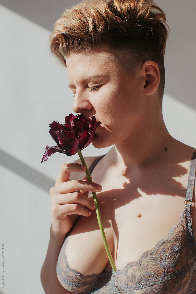 Androgynous woman with tulip