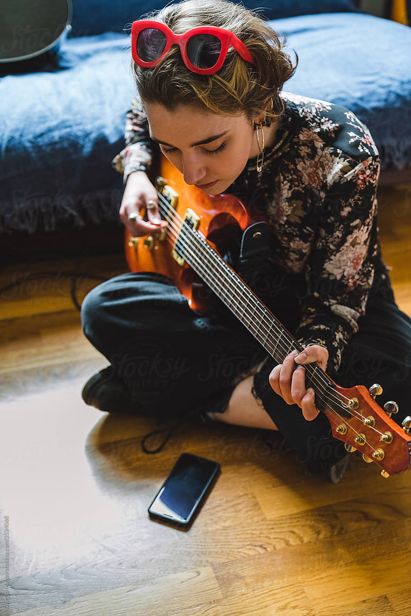Girl Learning to Play Electric Guitar