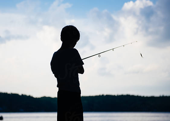 Young Boy Fishing On Lake Almanor by Stocksy Contributor