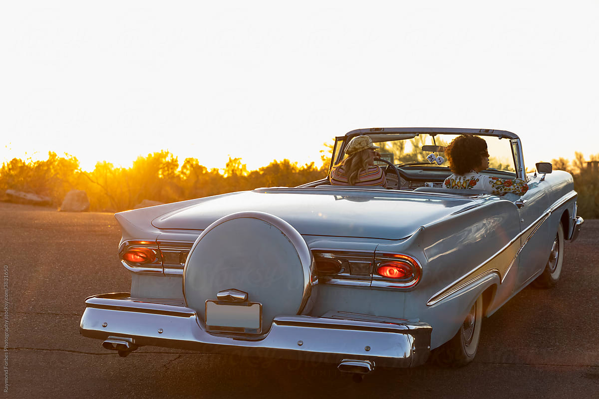 Two Girls Together on Road Trip in Vintage Car