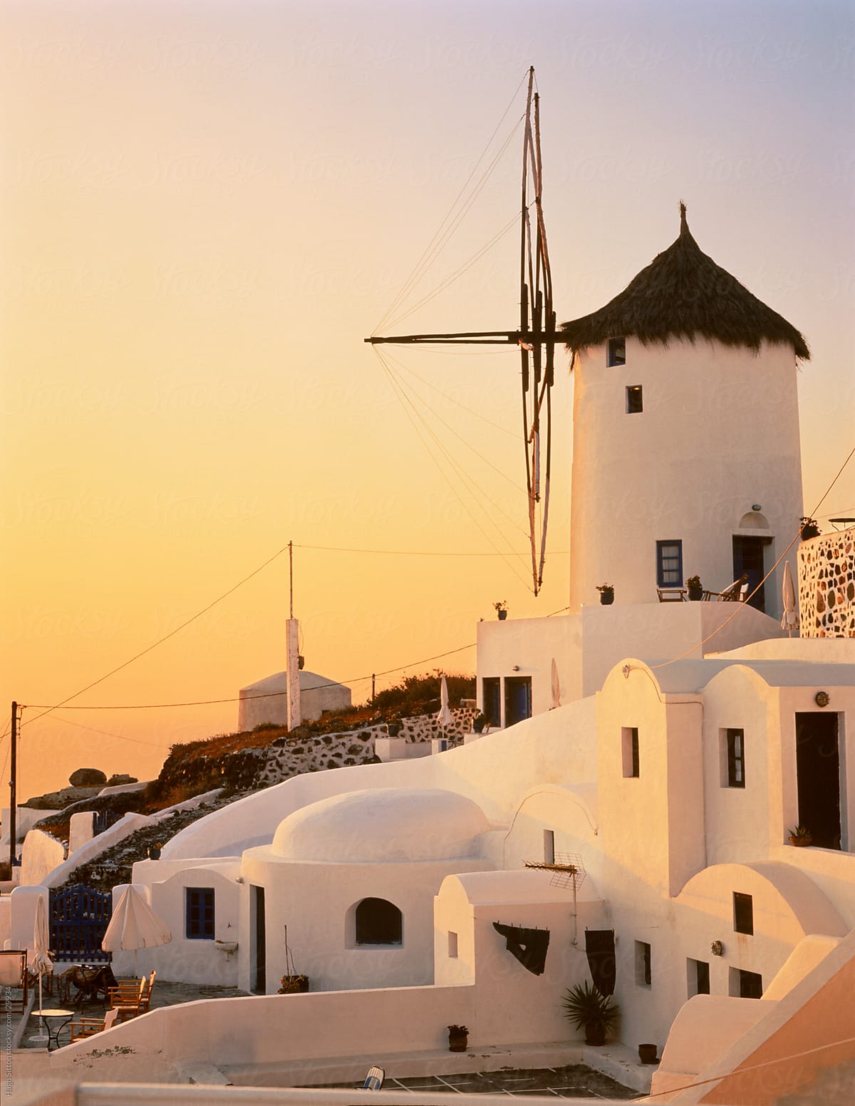 Windmill of Oia at sunset. Santorini. Greece.