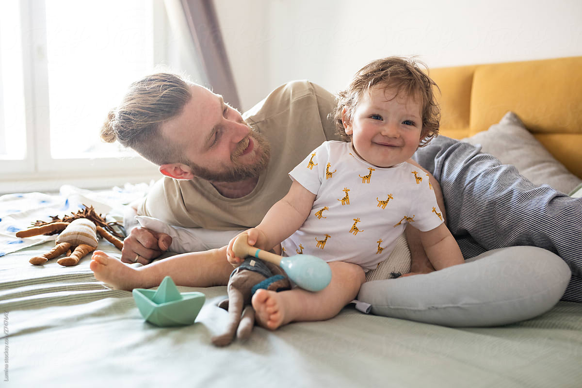 Father and baby Enjoying Morning in Bed