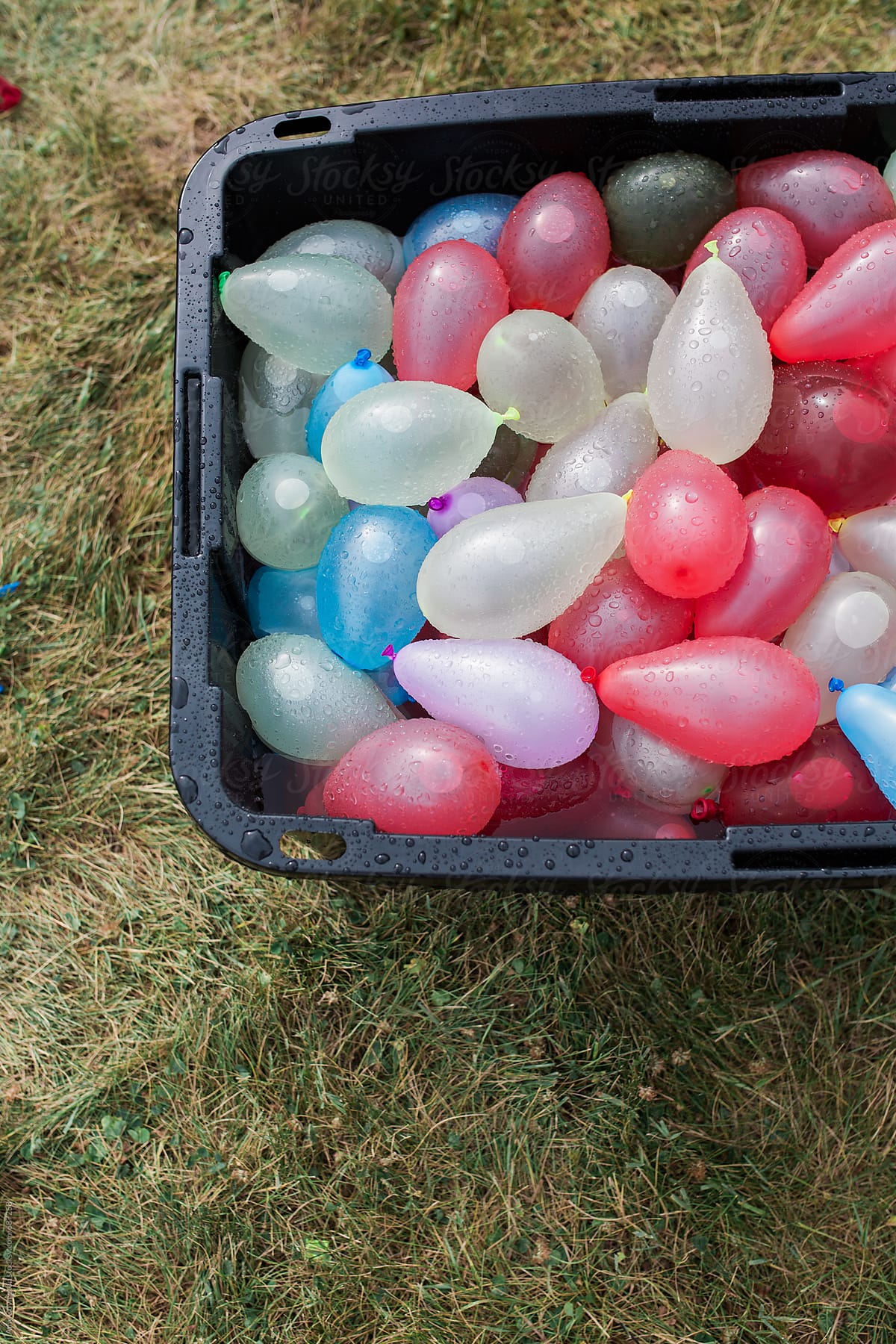 A container filled with water balloons