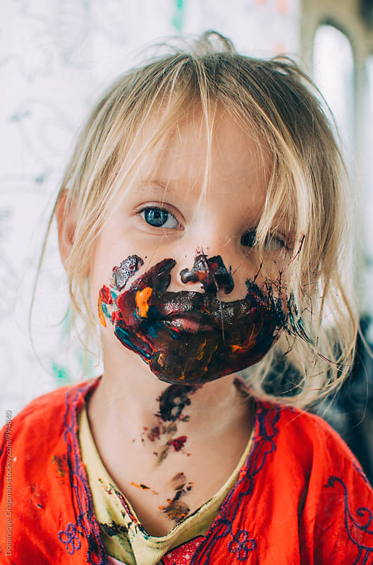 Girl covered in paint around her face