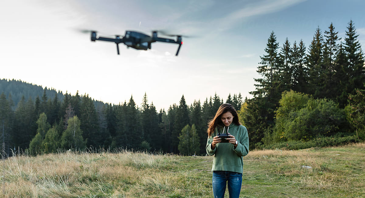 Young woman piloting a drone