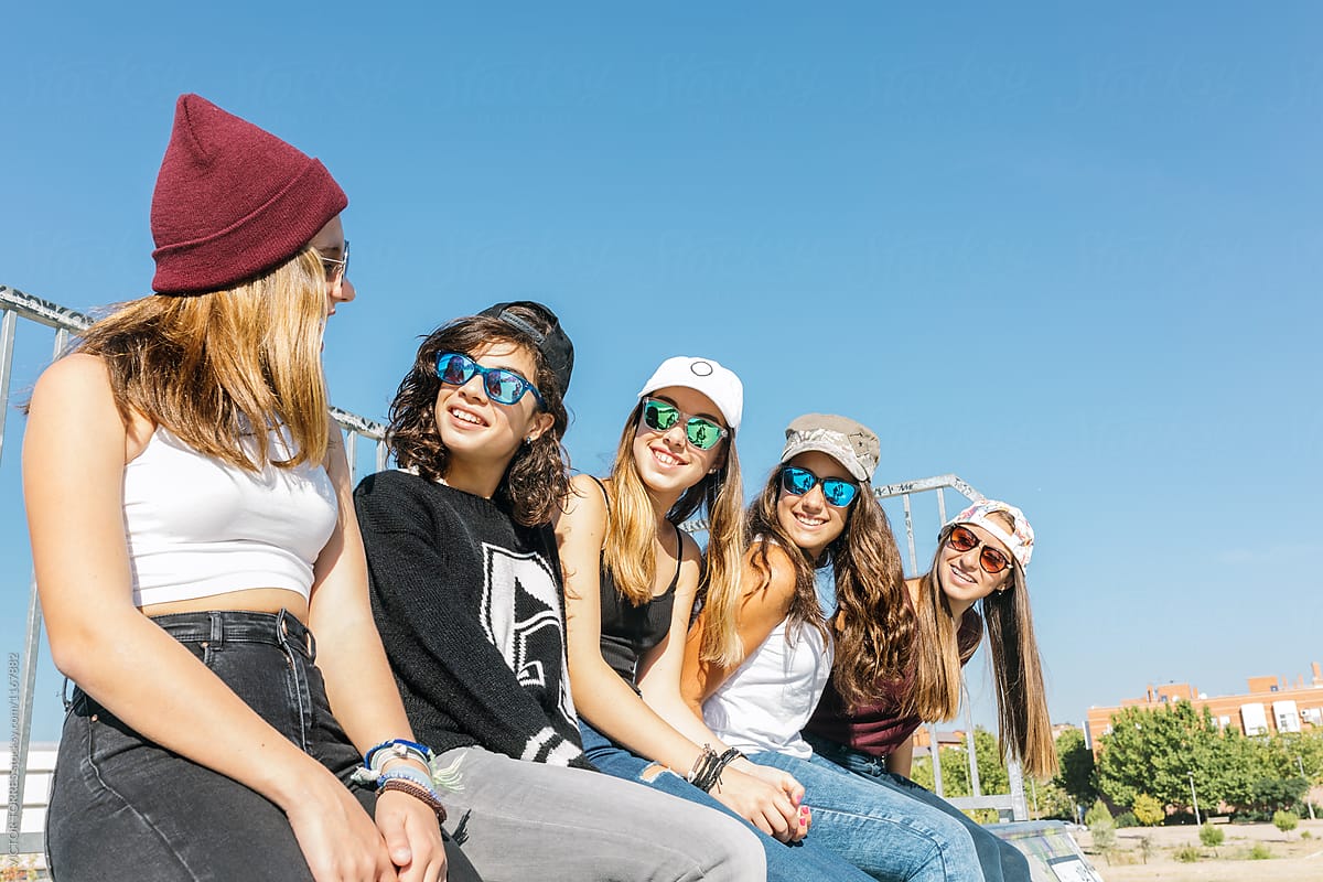 Five Girls Sitting Close To Each Other By Stocksy Contributor Victor Torres Stocksy 0799