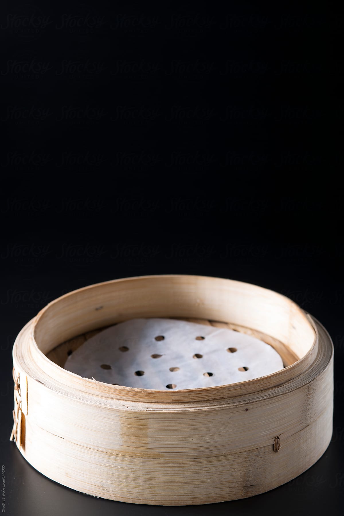 Chinese tableware, steamer, empty. On a black background