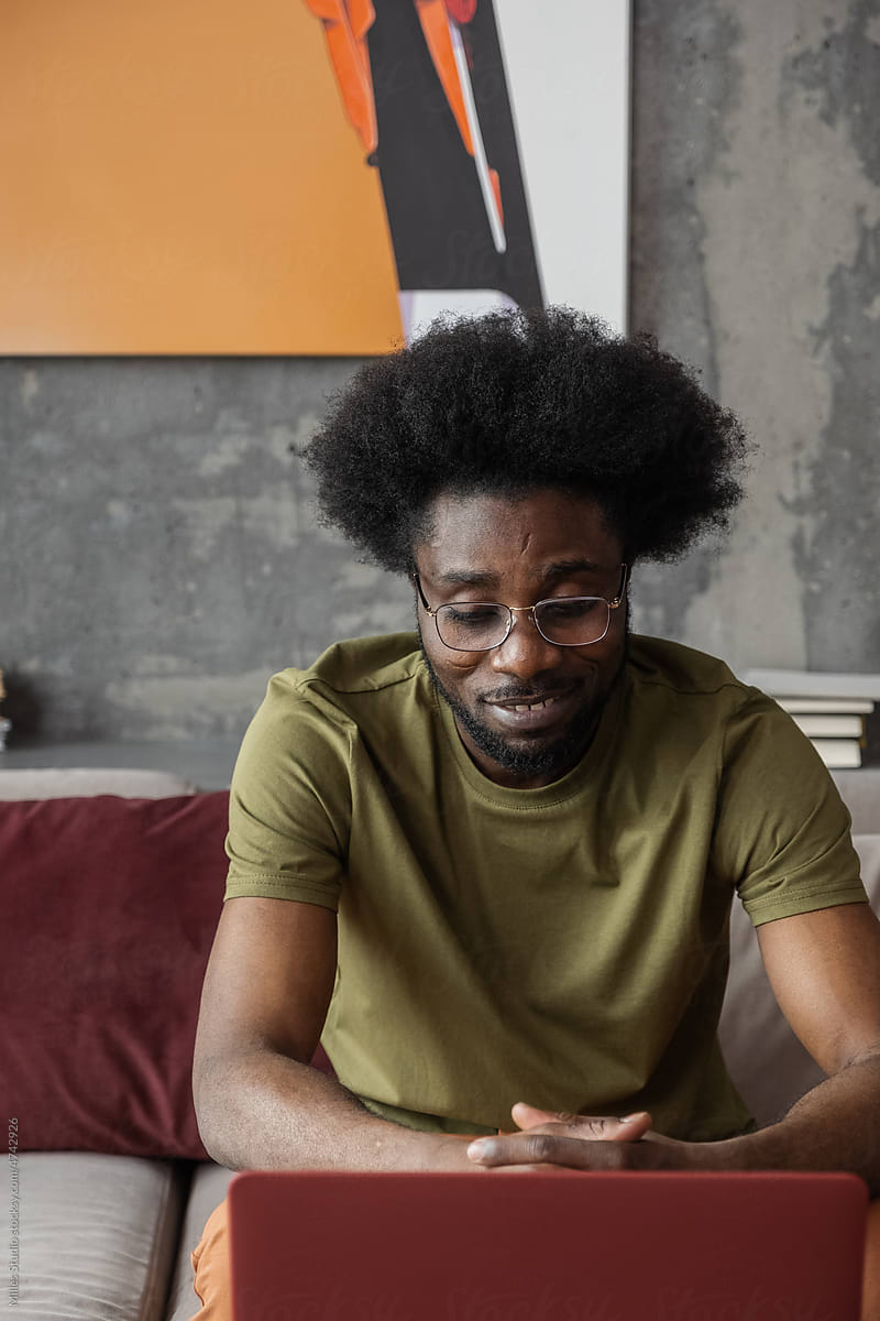 Positive black freelancer during online meeting
