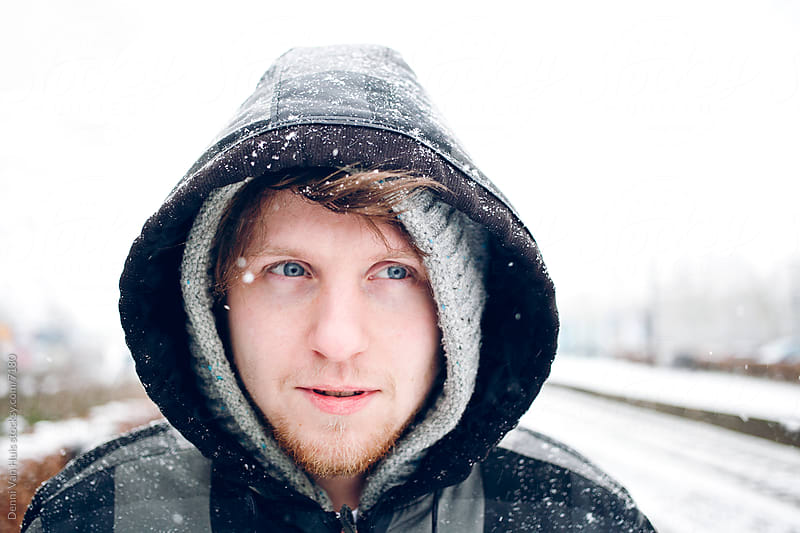 Young man standing in the cold by Denni Van Huis - Snow, Smile ...