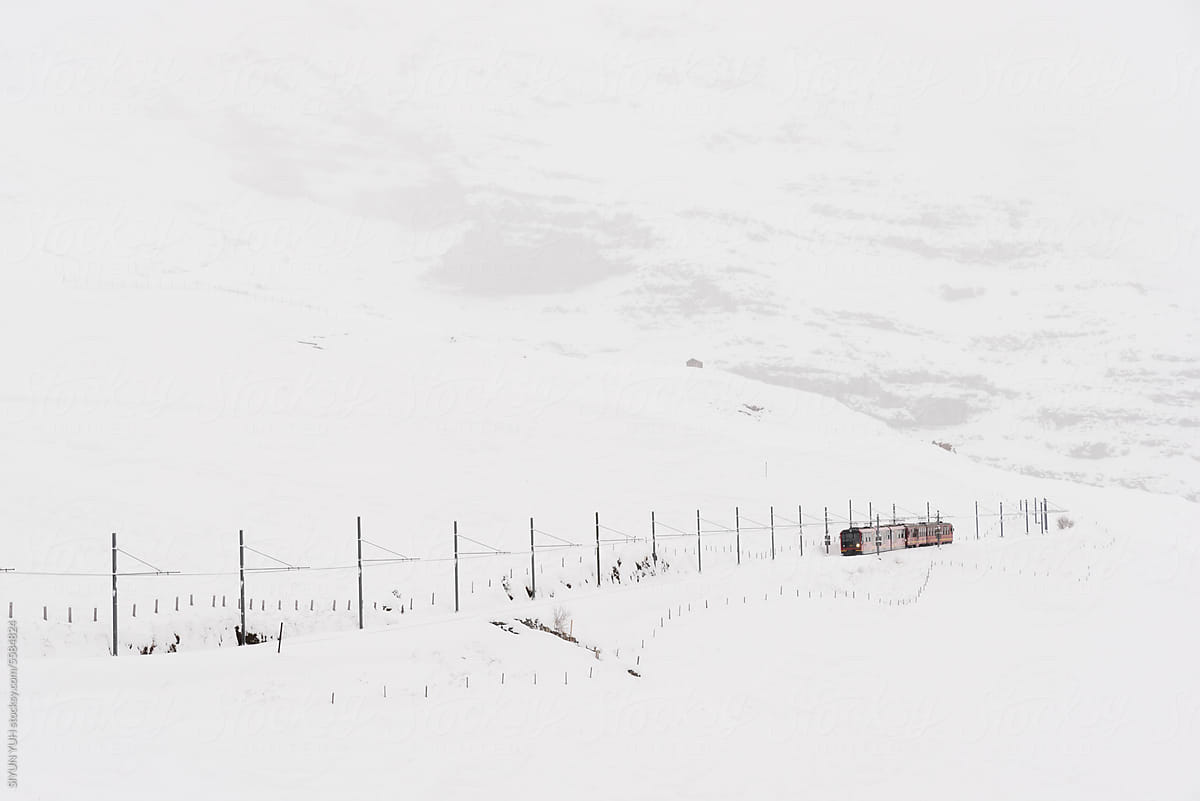 Train passing on the snow mountain in Switzerland