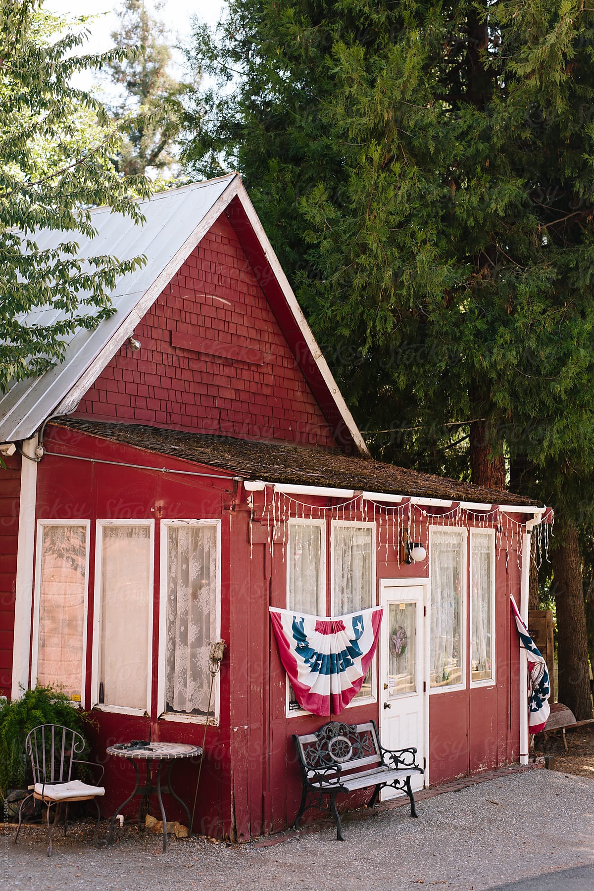 Red house with American flag design in front