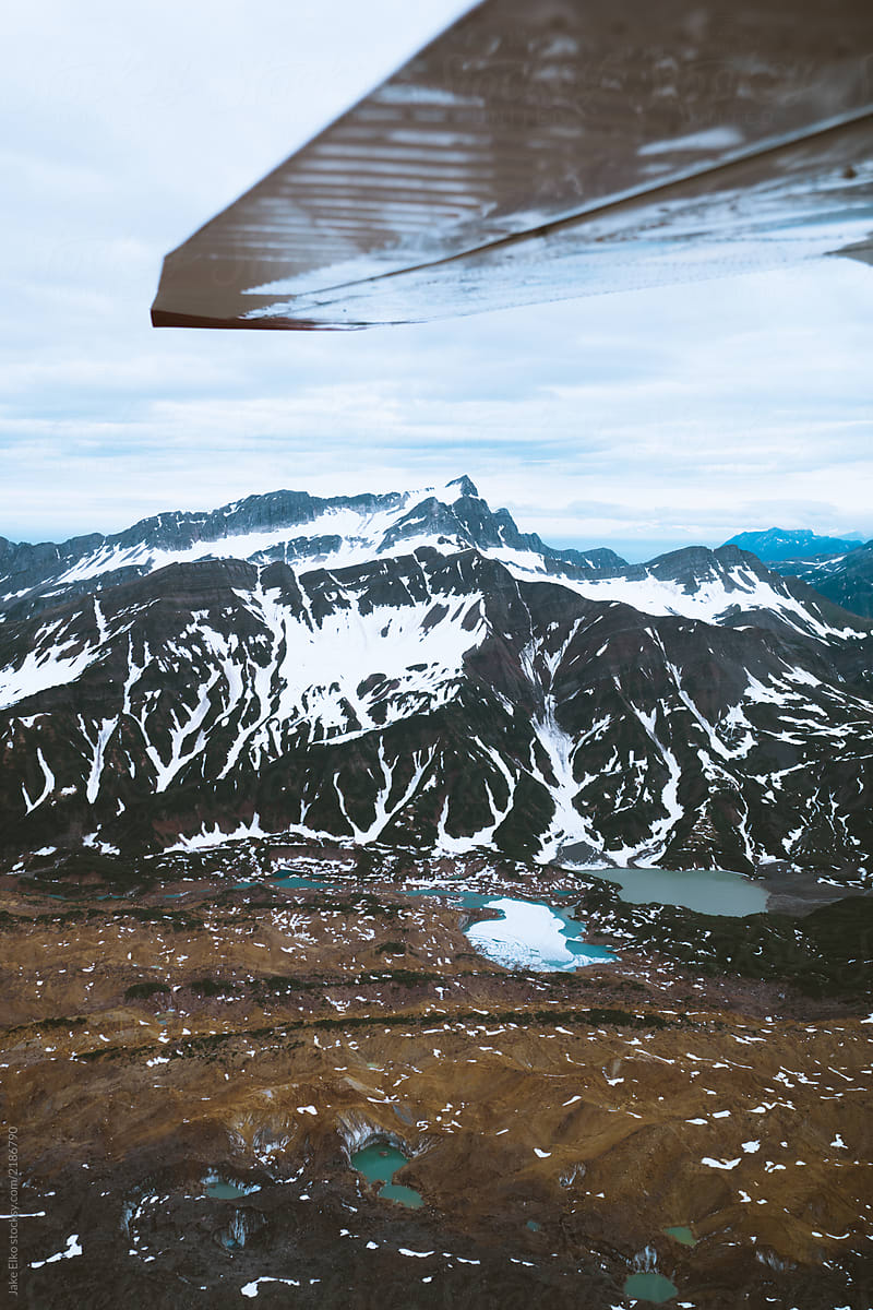 Looking Out of a Plane at Glacial Lakes In Alaska