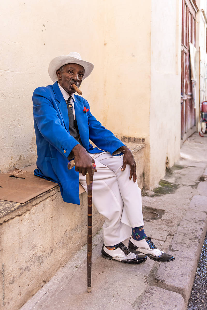 Elegant Old Man Smokes In The Streets Of Cuba