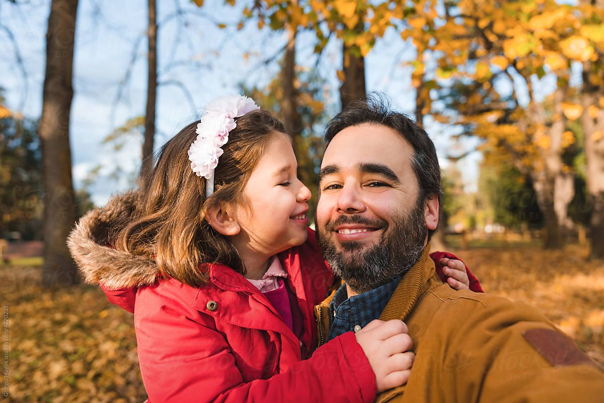 Child with Father in Autumnal Photo