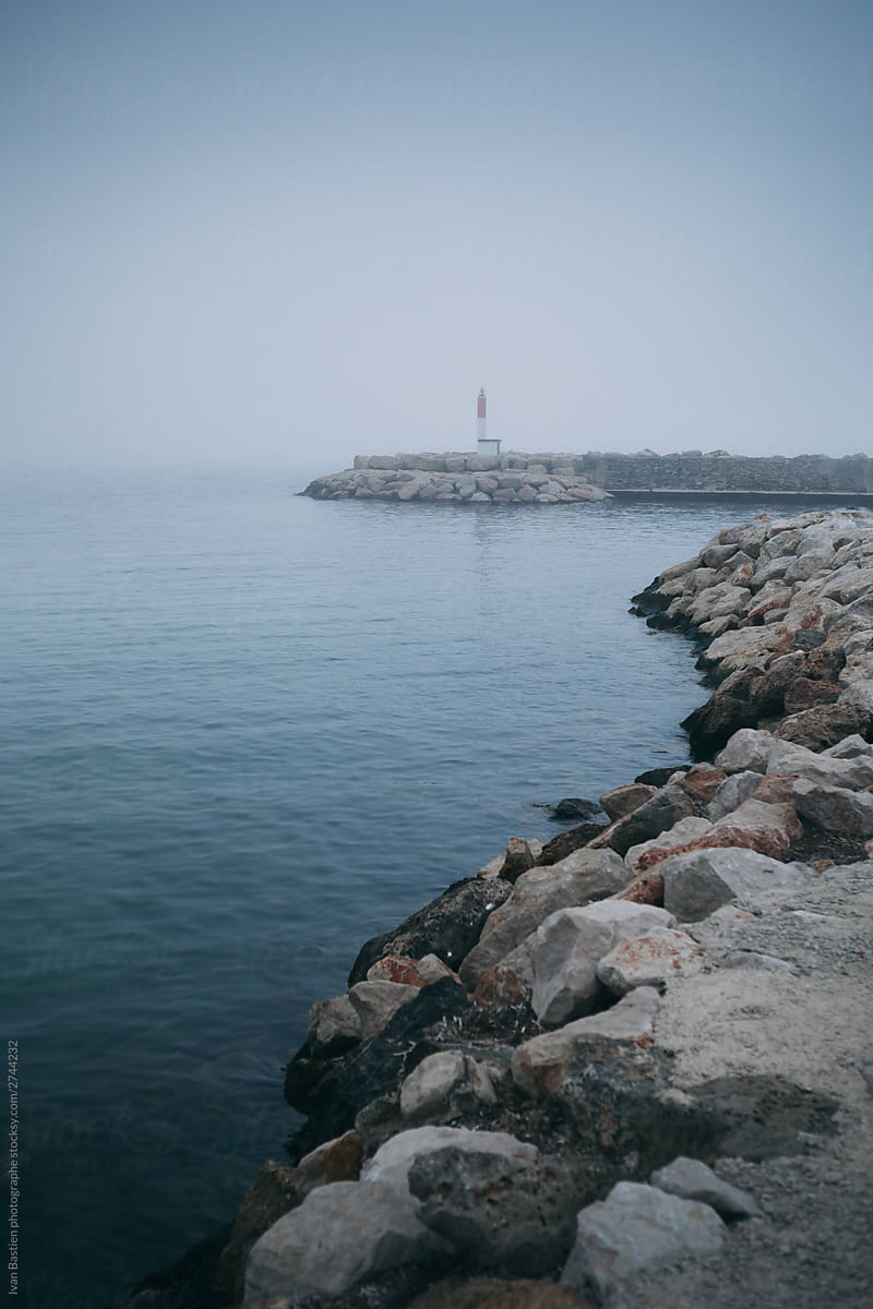 Little lighthouse in the fog on the French Riviera near Toulon