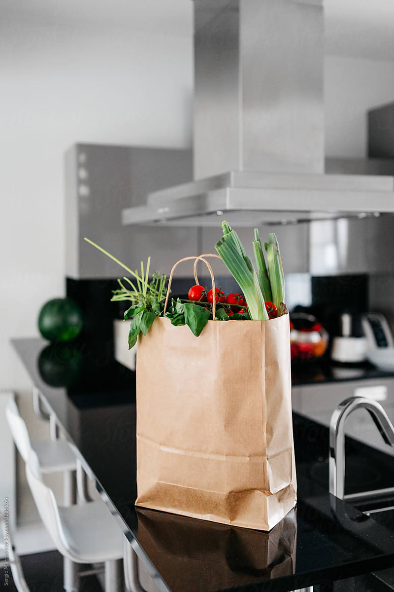 Paper bag of groceries on the kitchen counter