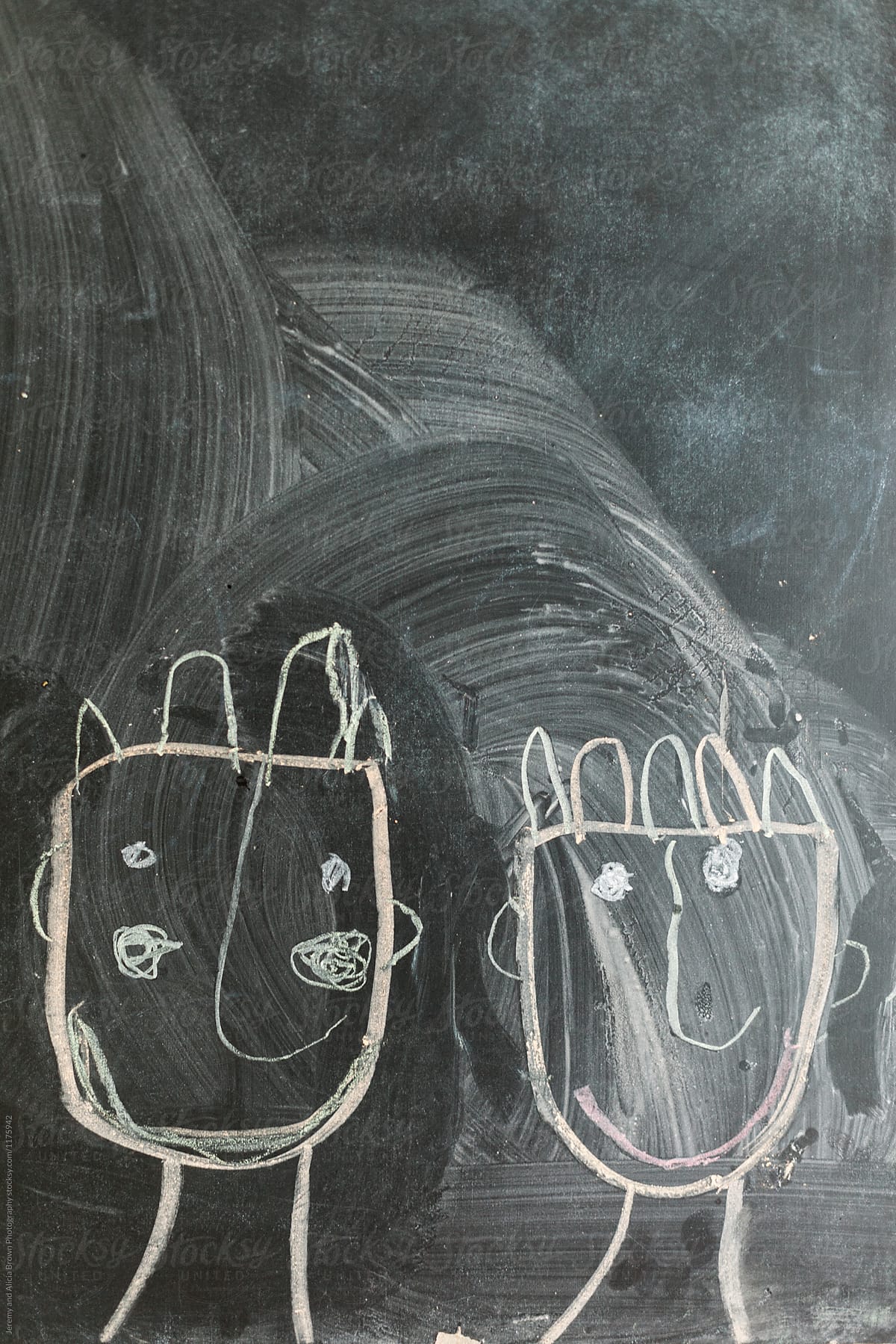 Child's chalkboard drawing of two people