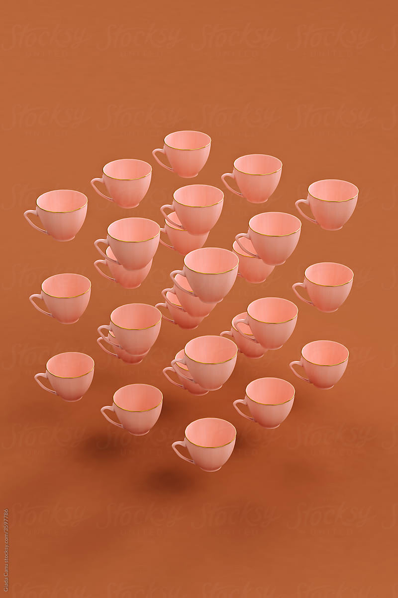 Pink coffee cup floating on brown background