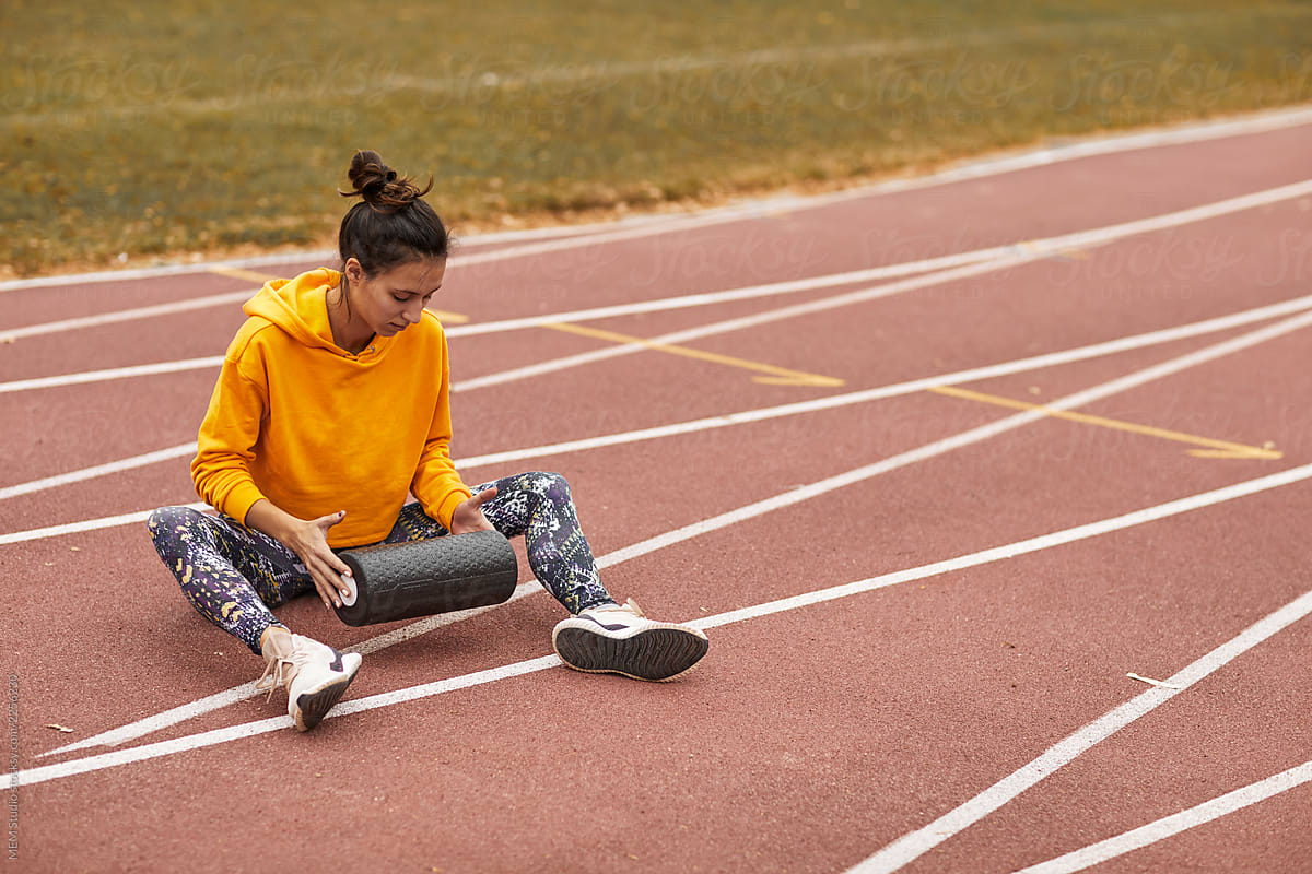 Woman training at a running track