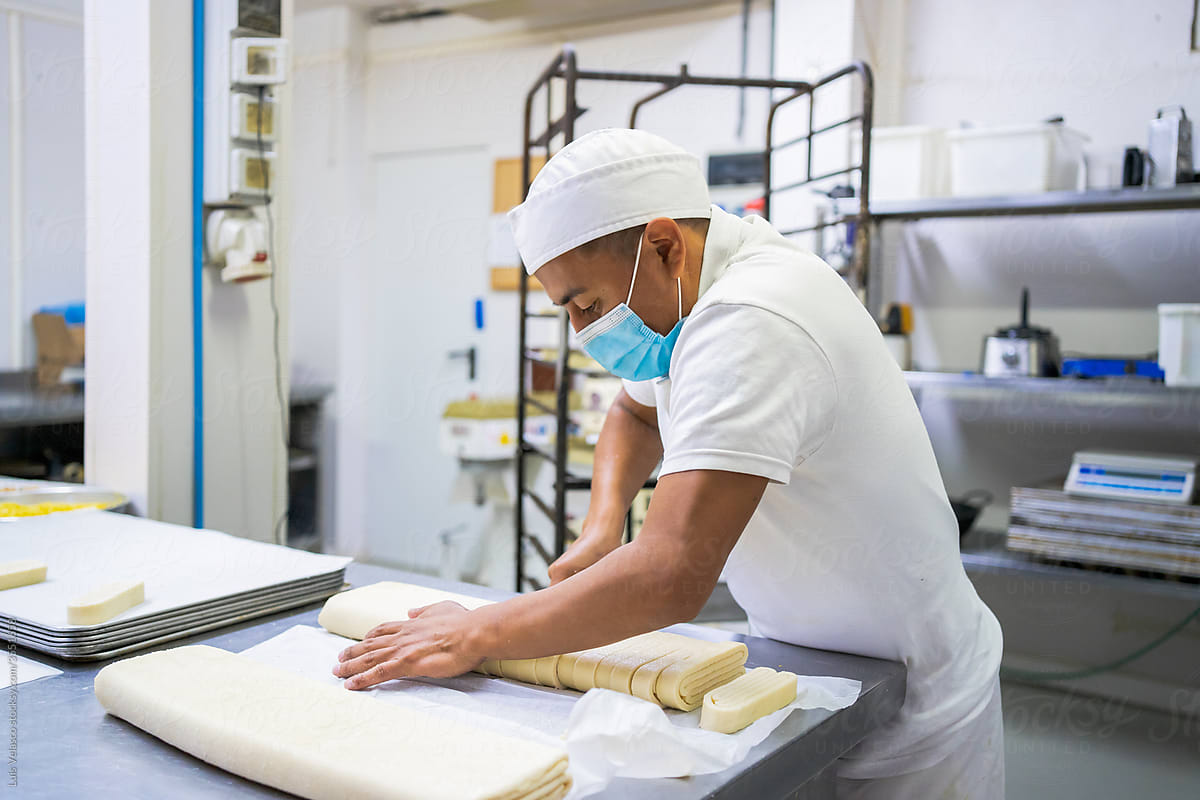 Hispanic Worker In A Cookie\'s Factory