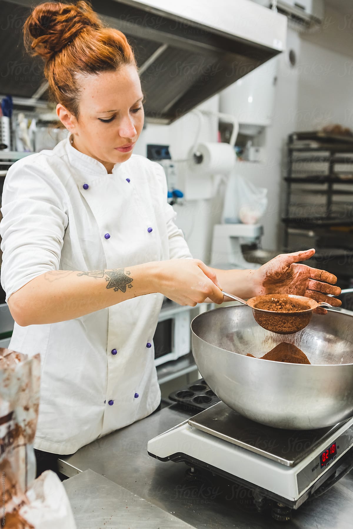 Pastry Chef Measuring Cocoa Powder on an Electronic Scale