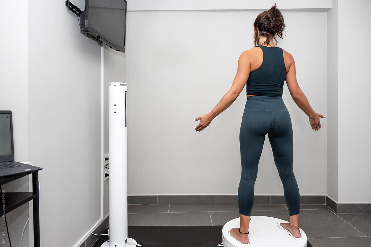 Sportswoman on 3D body scanner