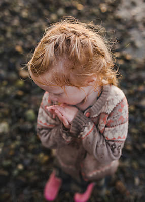 Little Girl With Red Ribbon In Her Braided Hair And Dress Back Unbuttoned  by Stocksy Contributor Amanda Voelker - Stocksy