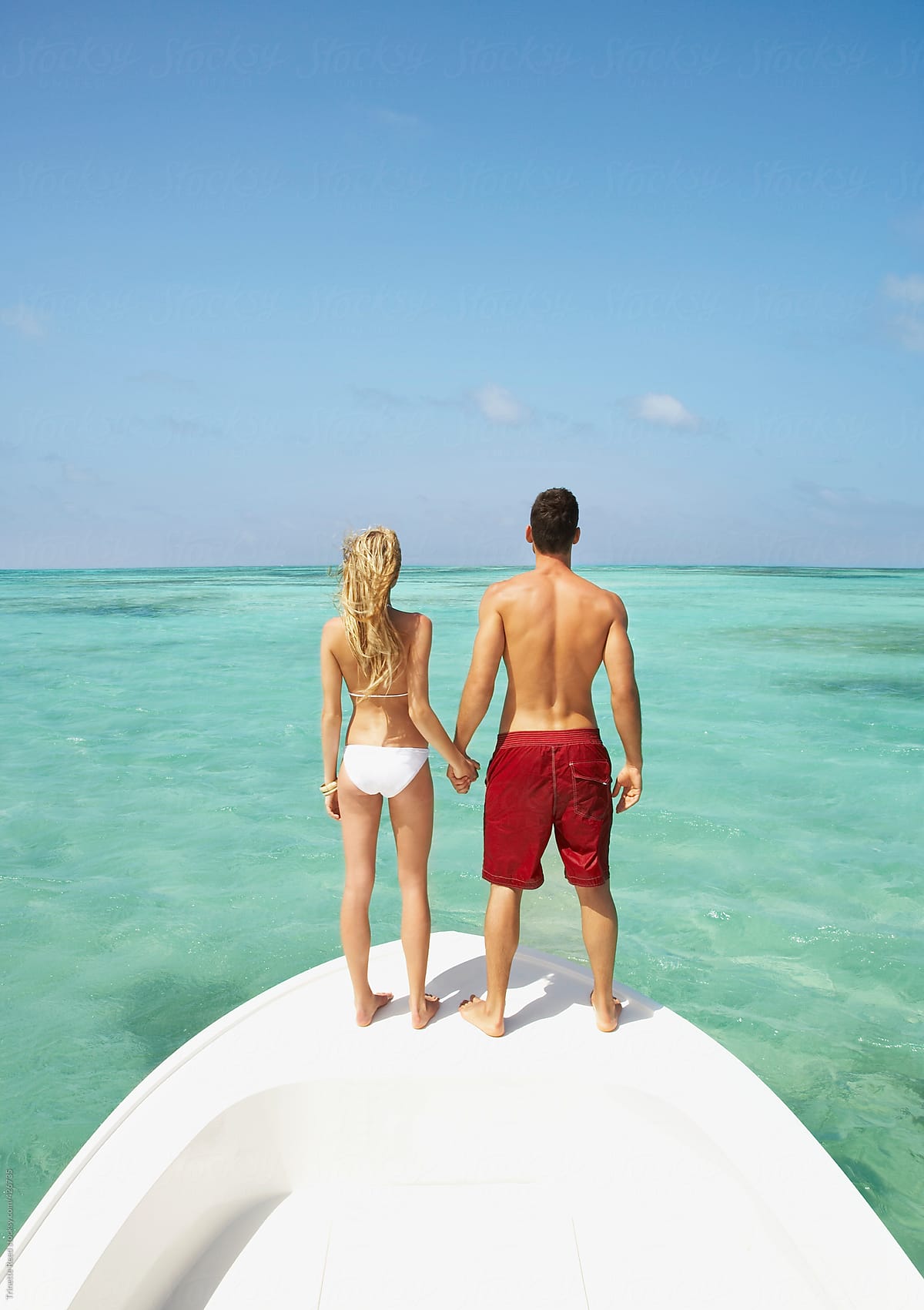 Couple relaxing on vacation on a boat in the Caribbean