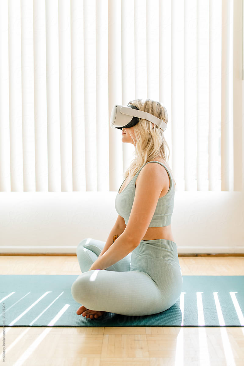Blonde Woman Gets Ready for a VR Yoga Class