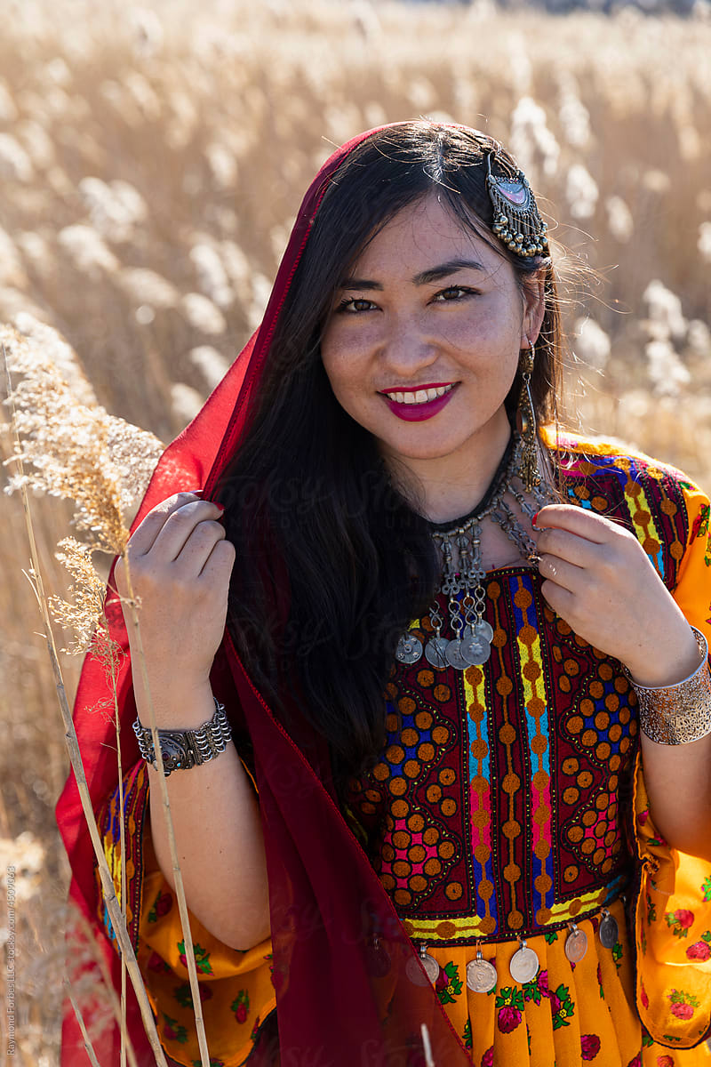 Young Afghani Woman Portrait in Traditional Dress in field