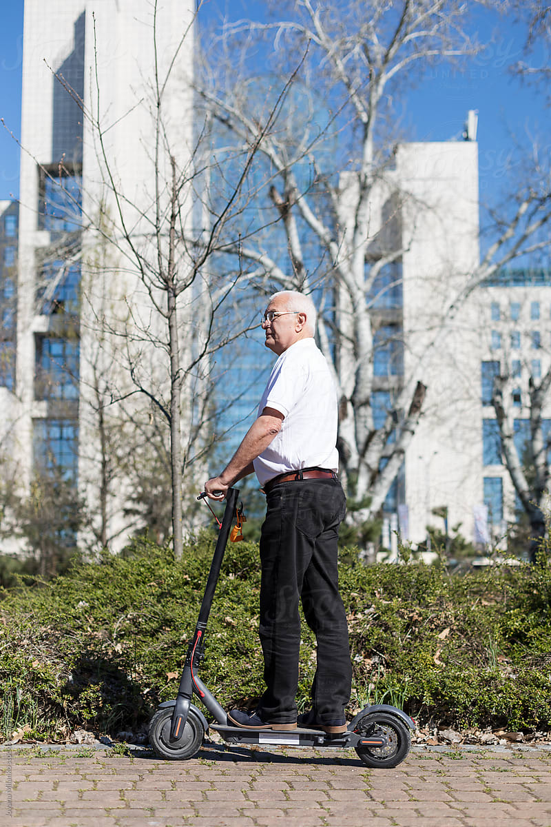 Senior Man Riding an Electric Scooter