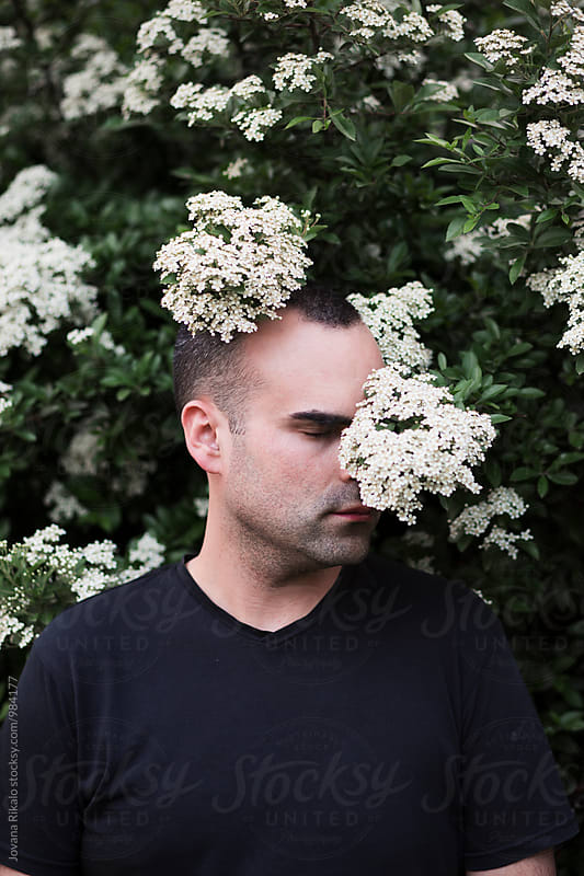 Man and white flowers