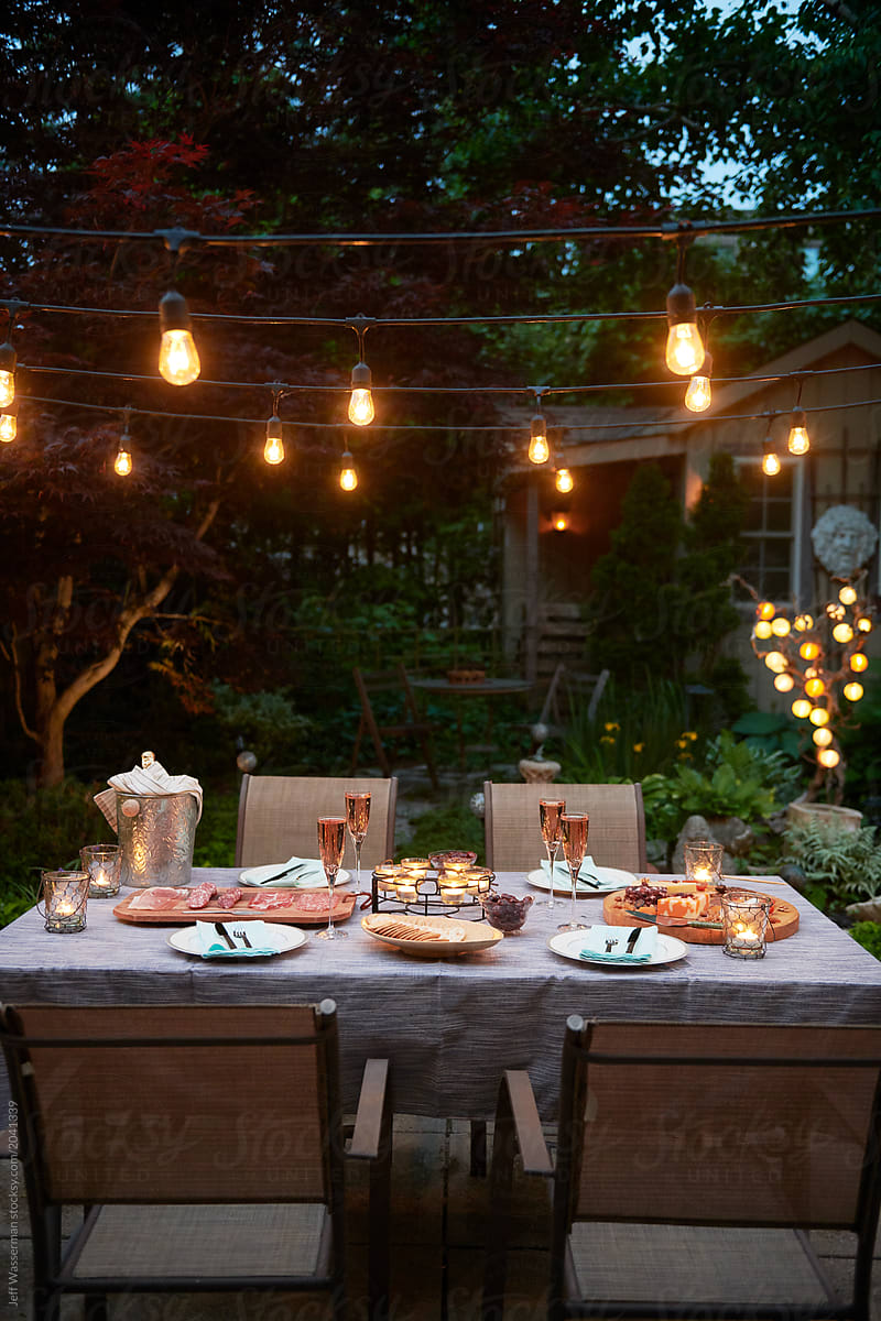 Patio Lights at Evening Dinner Party in Garden