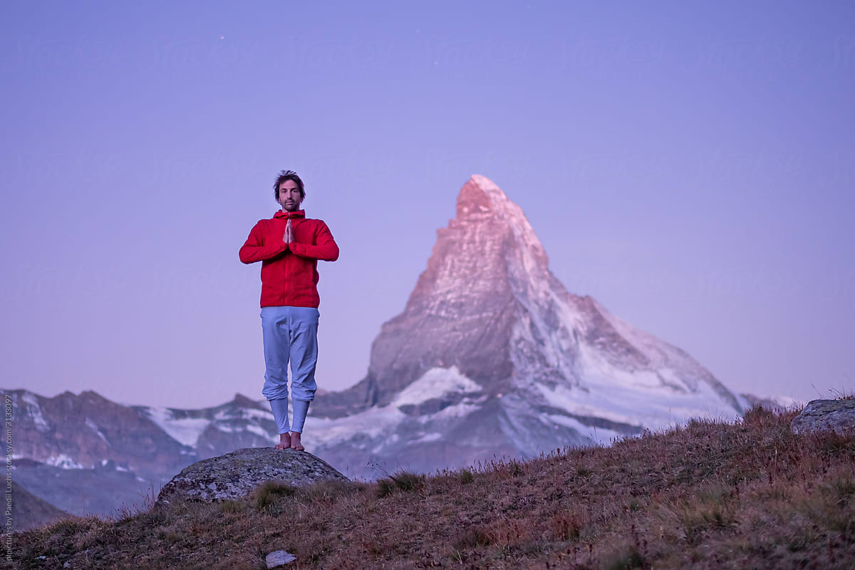 Prayer yoga pose at the Matterhorn at dawn